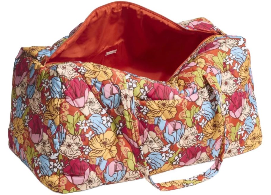 Stock image of an unzipped vera bradley duffel bag