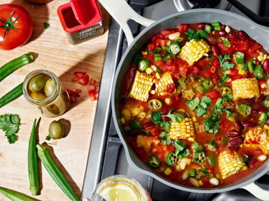 Beautiful All-in-One 4 QT Hero Pan filled with corn and other foods