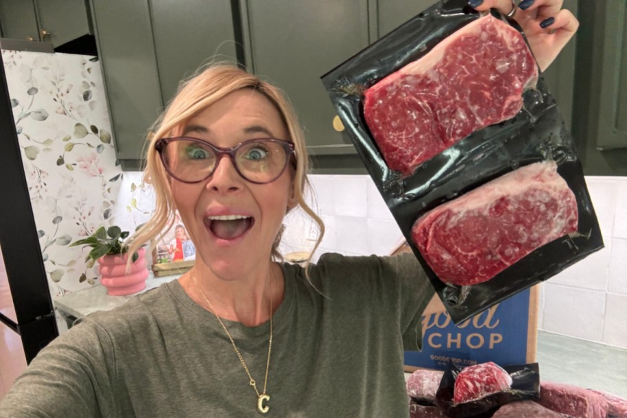 woman holding up good chop meat