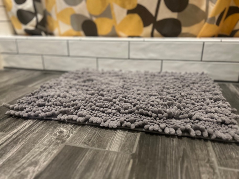 close up of bathroom rug on tile floor