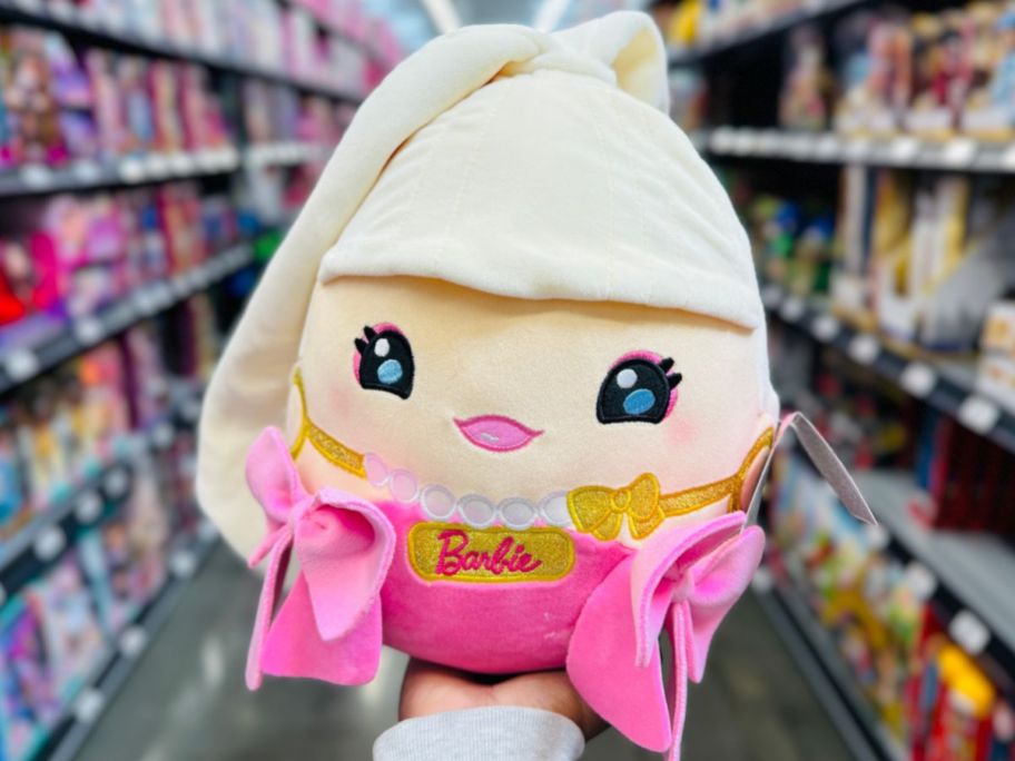 Hand holding up a Barbie Cutopia 10 Plush 