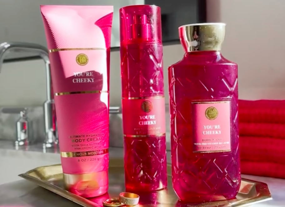 Bath & Body Works You're Cheeky Body Care Items sitting on gold tray in bathroom