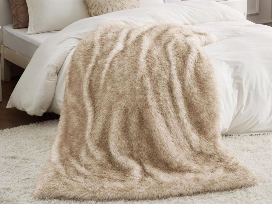 A Bedsure Throw Fur on a bed