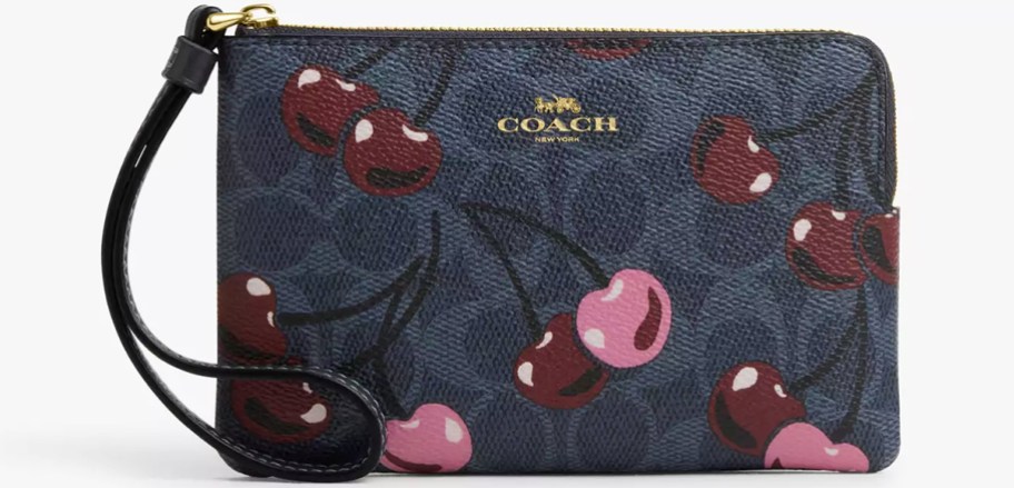 navy blue coach wristlet with cherry print