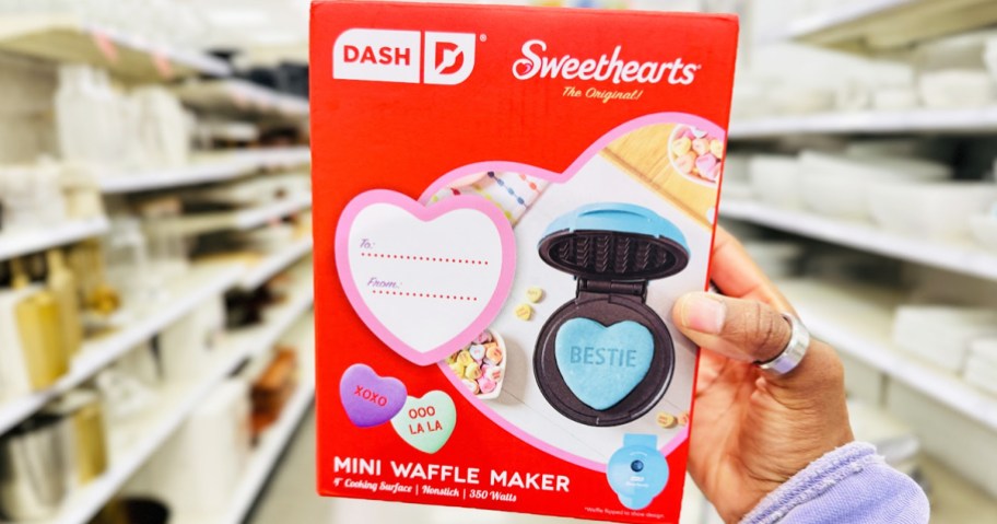 hand holding up Dash x Sweethearts Mini Waffle Maker <a href='https://sjf.a8c.myftpupload.com/product/sisters-in-style-collection' target='_blank' rel='follow'>box</a> in store” width=”912″ height=”479″></p>
<p>Head over to <a href=