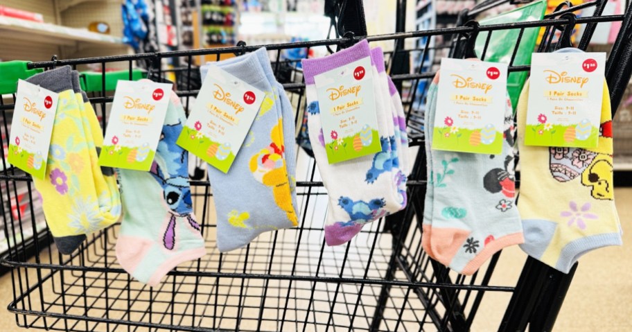 6 pairs of Disney Easter Socks hanging from shopping cart