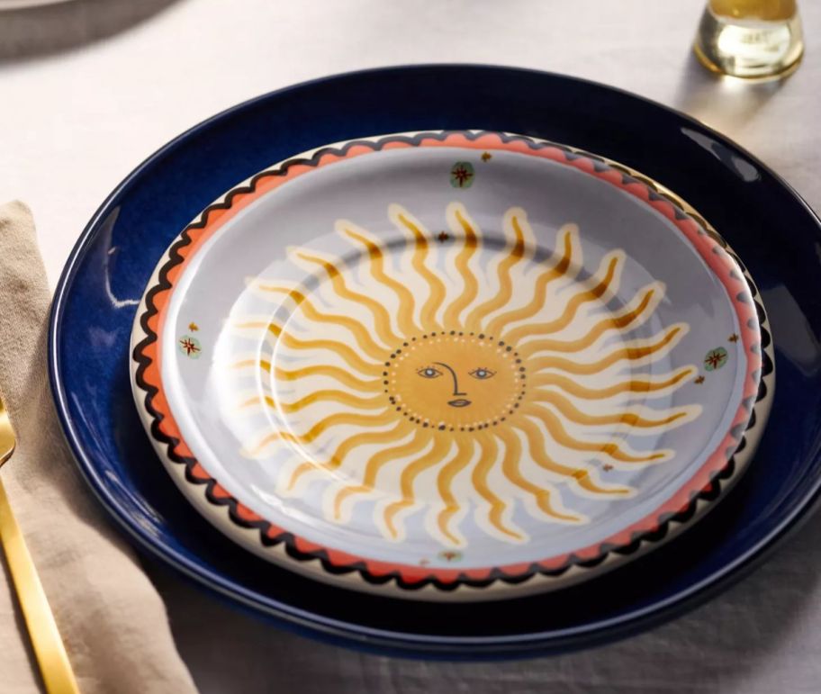 a stoneware desert plate with a sun motif