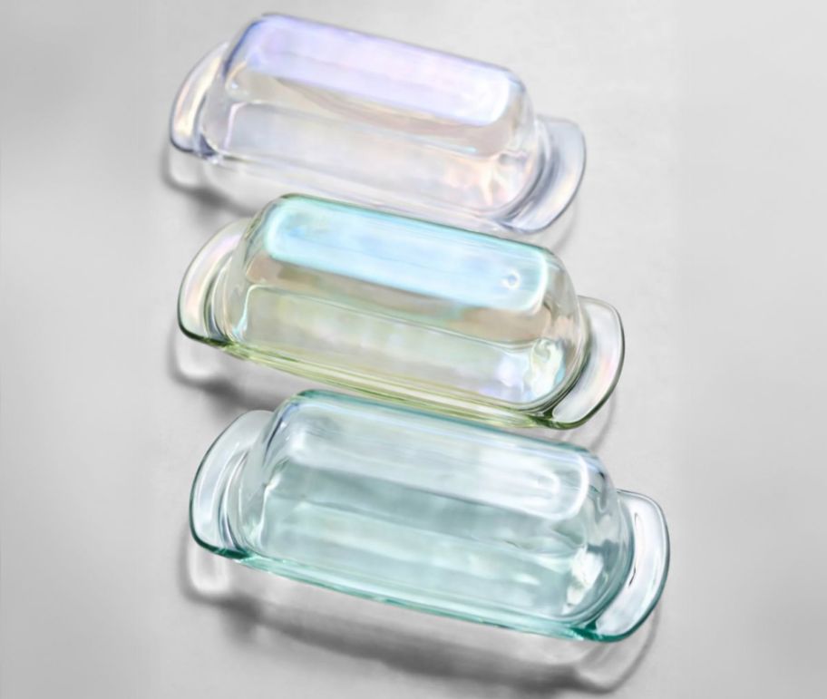 3 glass butter dishes in various hues.