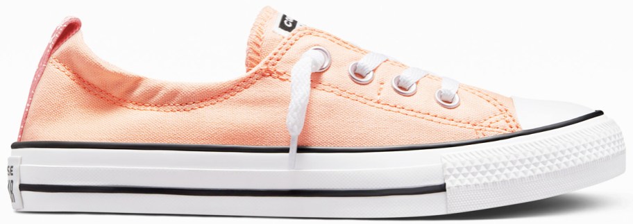 coral colored low top converse sneaker