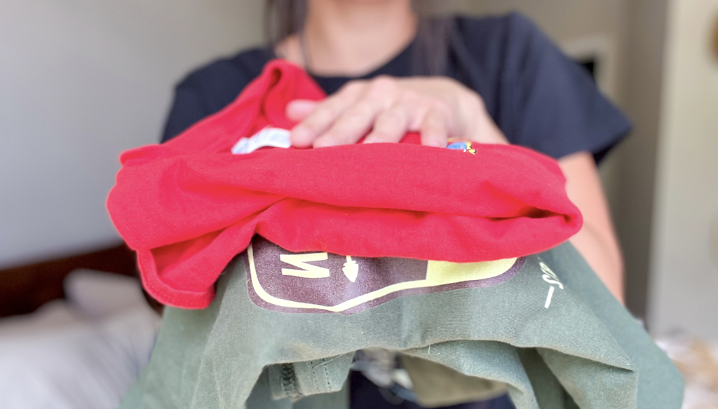 woman holding 2 graphic tshirts folded and stacked on <a href='https://online-shopping.fun/shop-smarter-with-amazons-best-selling-products' target='_blank' rel='follow'>top</a> of each other” width=”1024″ height=”584″></p>
<p>Through February 13th, hurry to <a href=