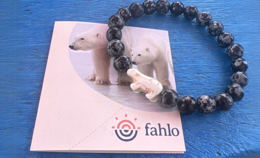 a fahlo venture polar bear bracelt shown with info card