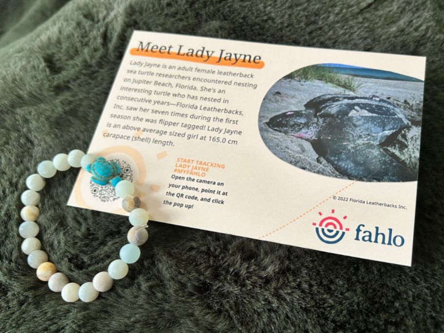 A Fahlo Journey Sea Turtle Tracking Bracelet and info card