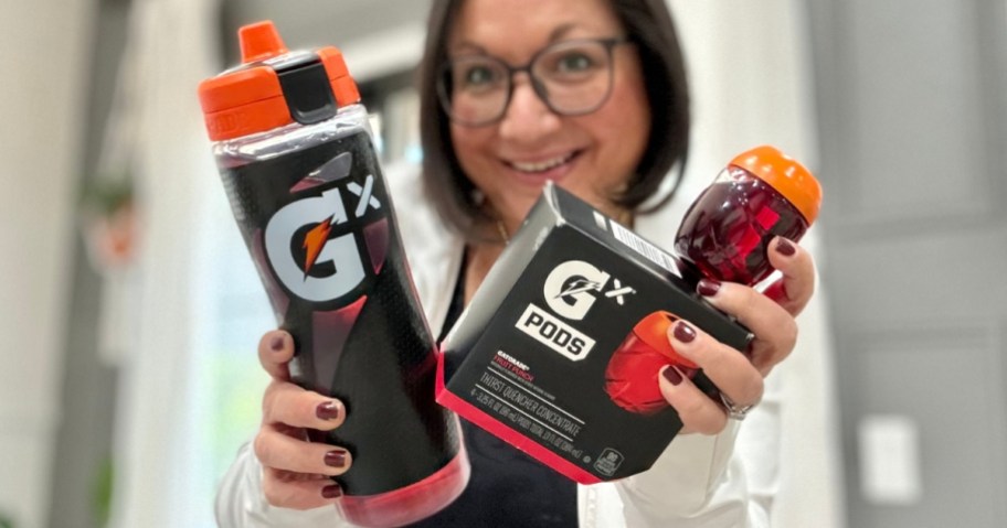 woman holding up gatorade bottle and box of gatorade pods