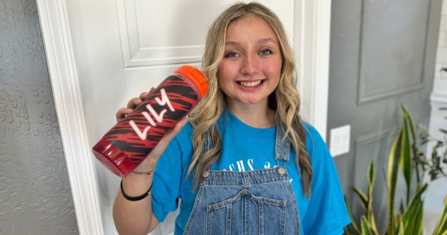 Teen girl holding a personalized gatorade water bottle