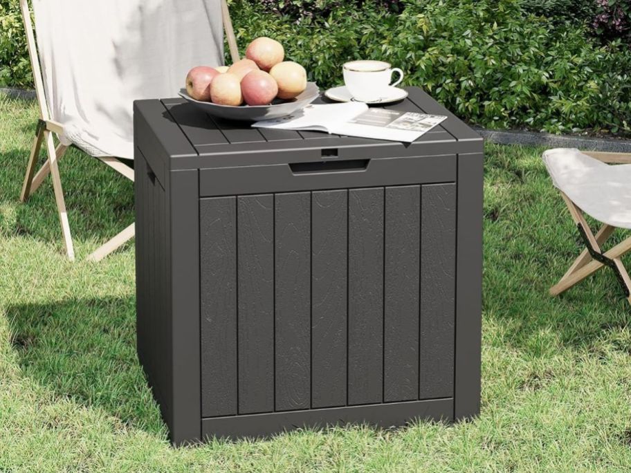 31-Gallon Outdoor Deck Box in Black on grass