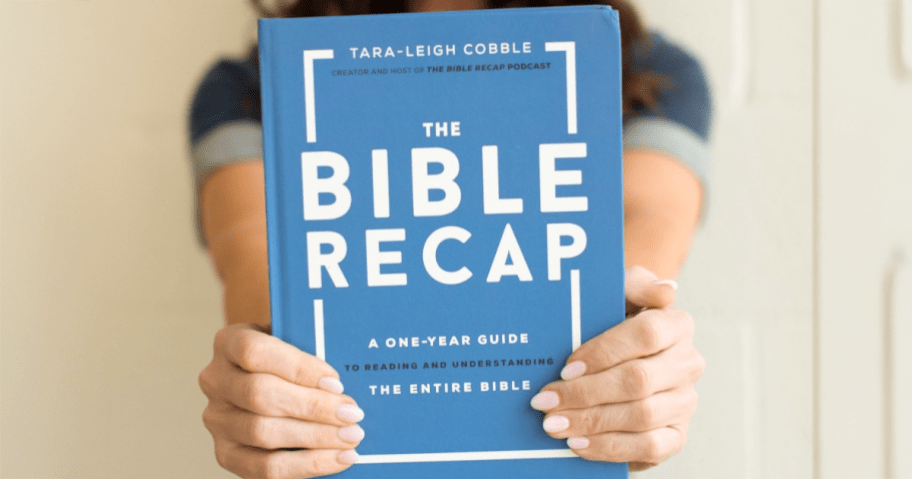 Woman holding The Bible Recap hardcover book