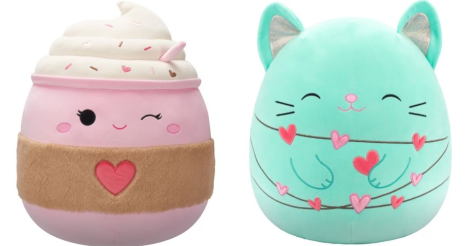 2 large Squishmallow plush toys, one is pink and white and looks like a latte, one is a green cat with a string of hearts 