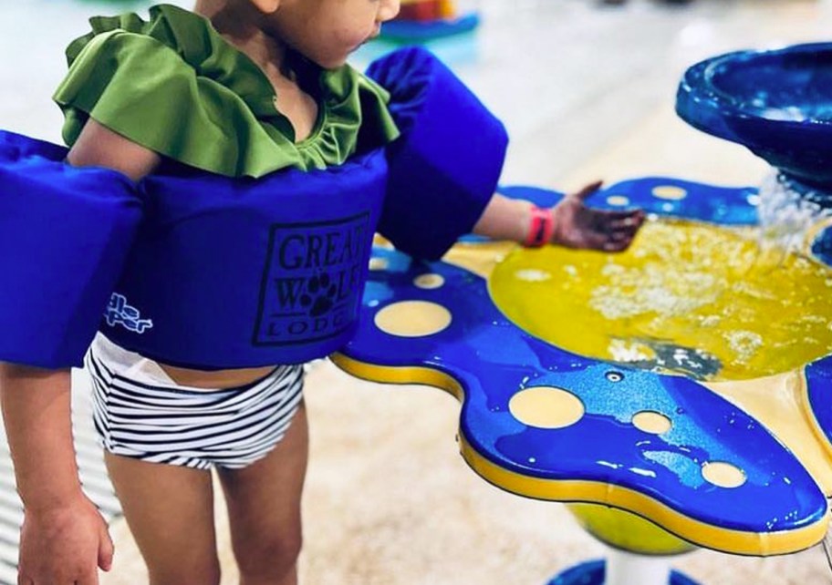 girl wearing great wolf lodge life vest