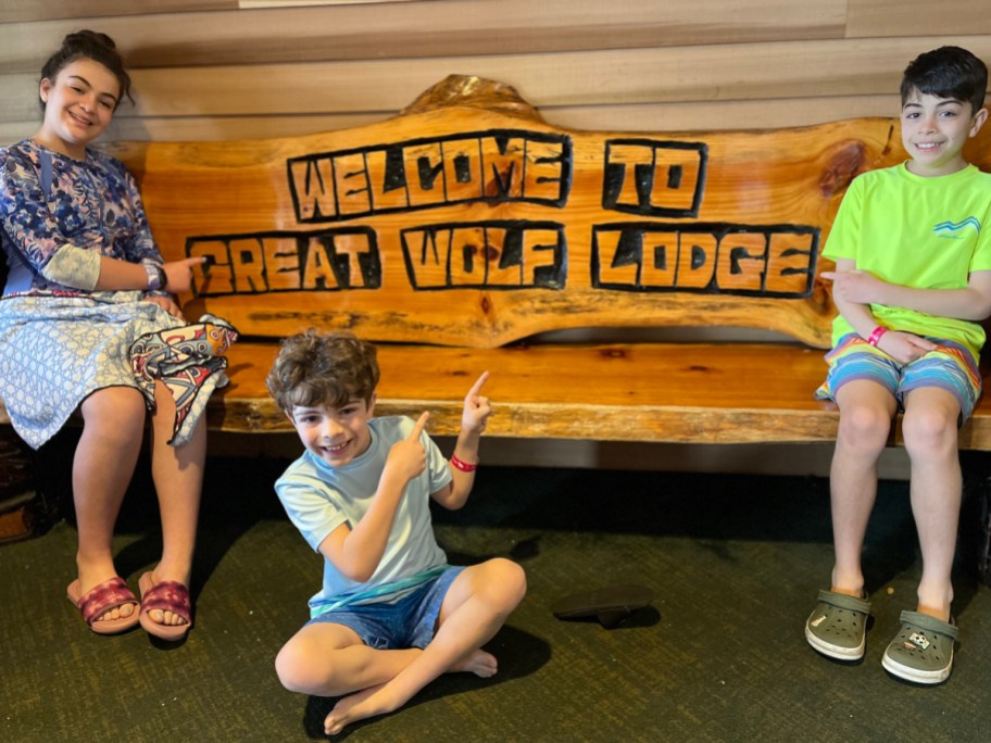 kids sitting on the great wolf lodge bench