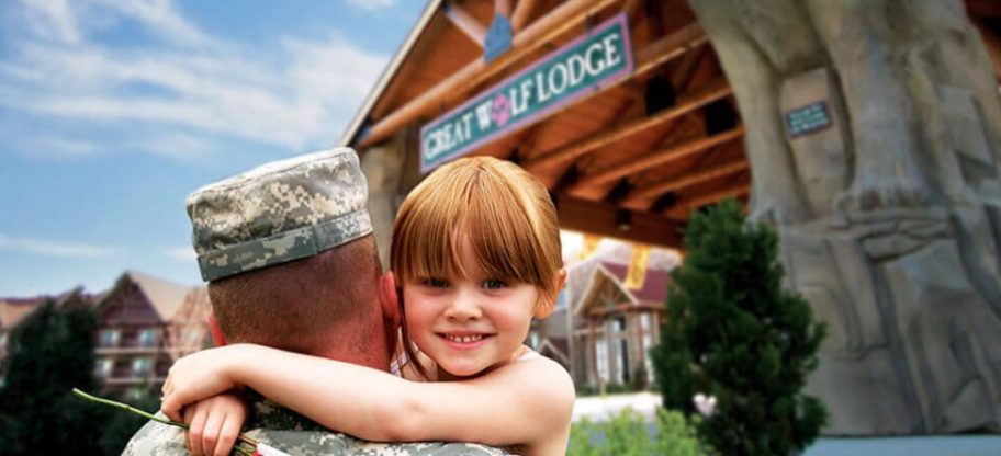 girl hugging man in service uniform