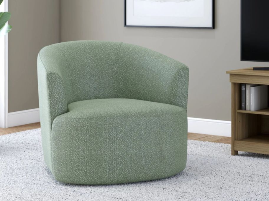 A green swivel chair in a living room 