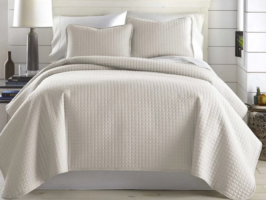 neutral quilt set on bed