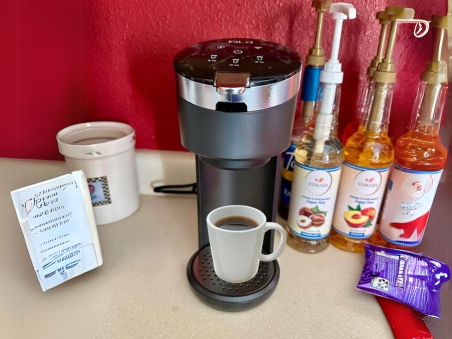 Instant Pot Solo WIFI Connect Single Serve Coffee Maker on counter with coffee accessories around it