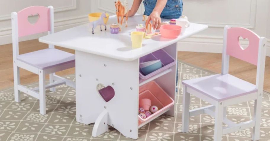 A kid's white and pink table and chair set with toys on <a href='https://online-shopping.fun/shop-smarter-with-amazons-best-selling-products' target='_blank' rel='follow'>top</a> and a little girl playing with them” width=”912″ height=”479″></p>
<p>For a limited time, hop on over to <a href=