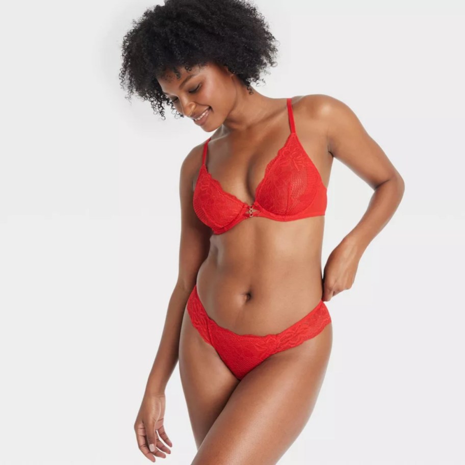 woman wearing red lace intimates