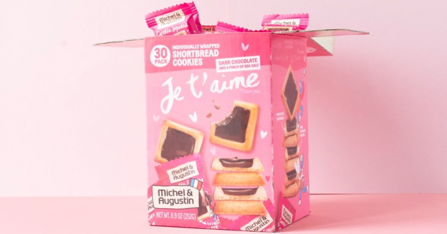 opened pink box of Michel et Augustin Dark Chocolate & Sea Salt Cookies on a pink background