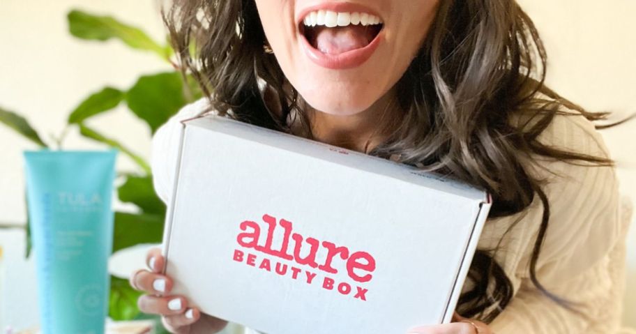 woman holding up an Allure Beauty Box