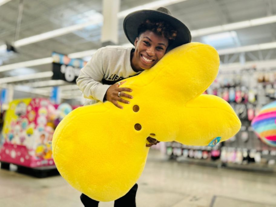 woman holding Peeps Jumbo Plush in store