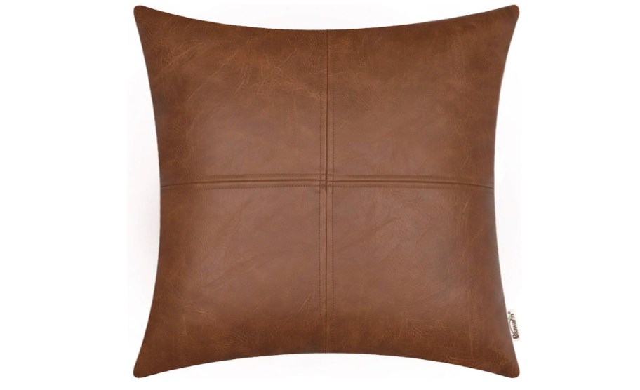 stock photo of brown faux leather pillow