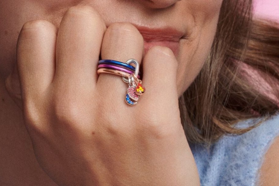 woman with three colorful rings