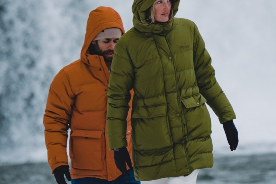 man and woman in puffer jackets