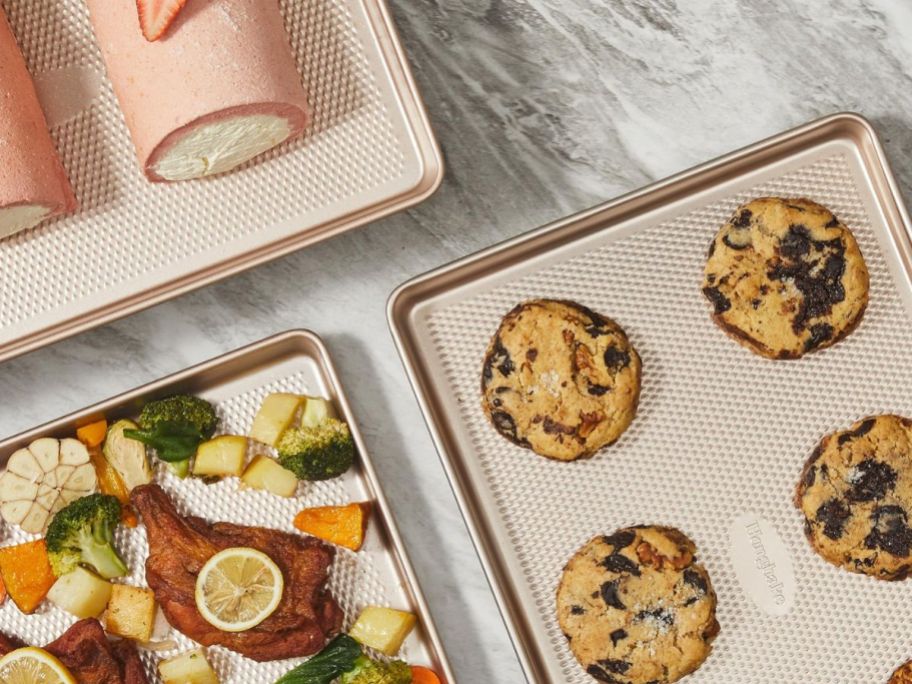 Hongbake Baking Sheet Pan Set with cookies, jelly rolls, and a meal on them