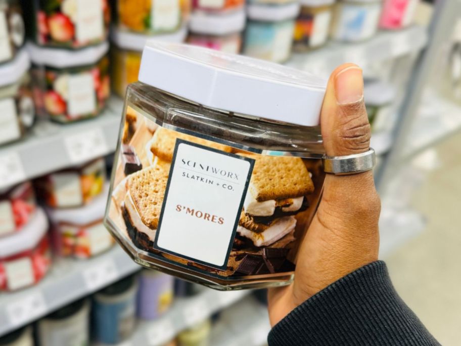 Hand holding a Scentworx S'mores 14.5oz Candle