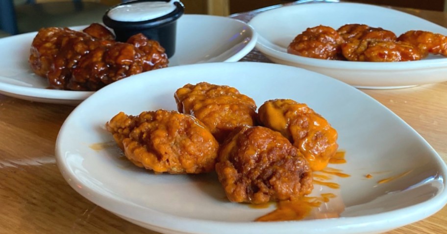 three plates of applebees-boneless-chicken-wings