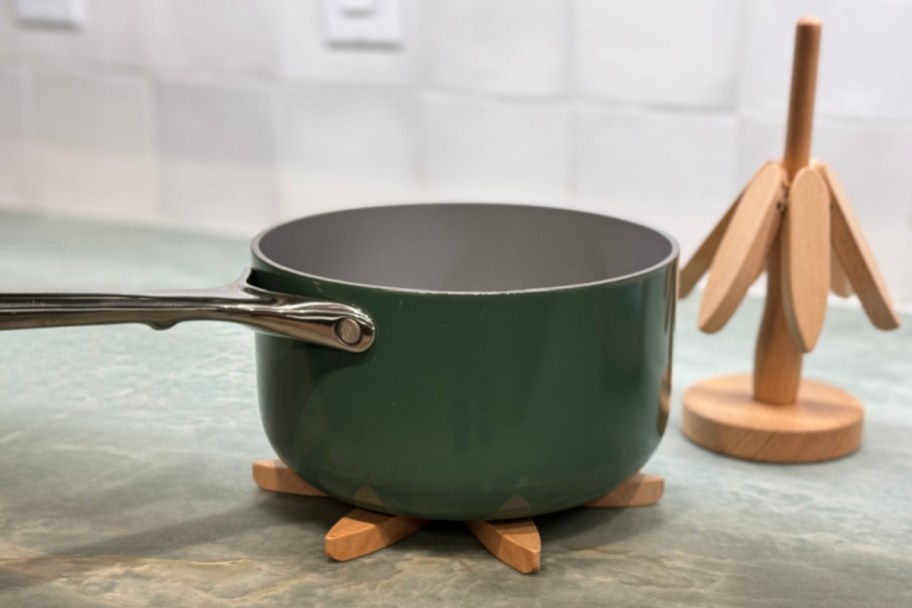 trivet under green pot next to stand