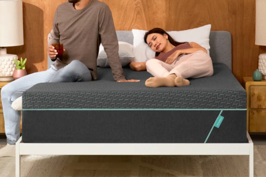 couple on dark grey hybrid mattress