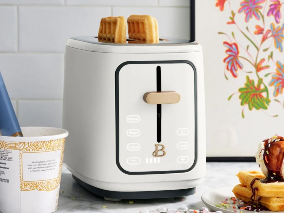 waffles inside a white and gold toaster