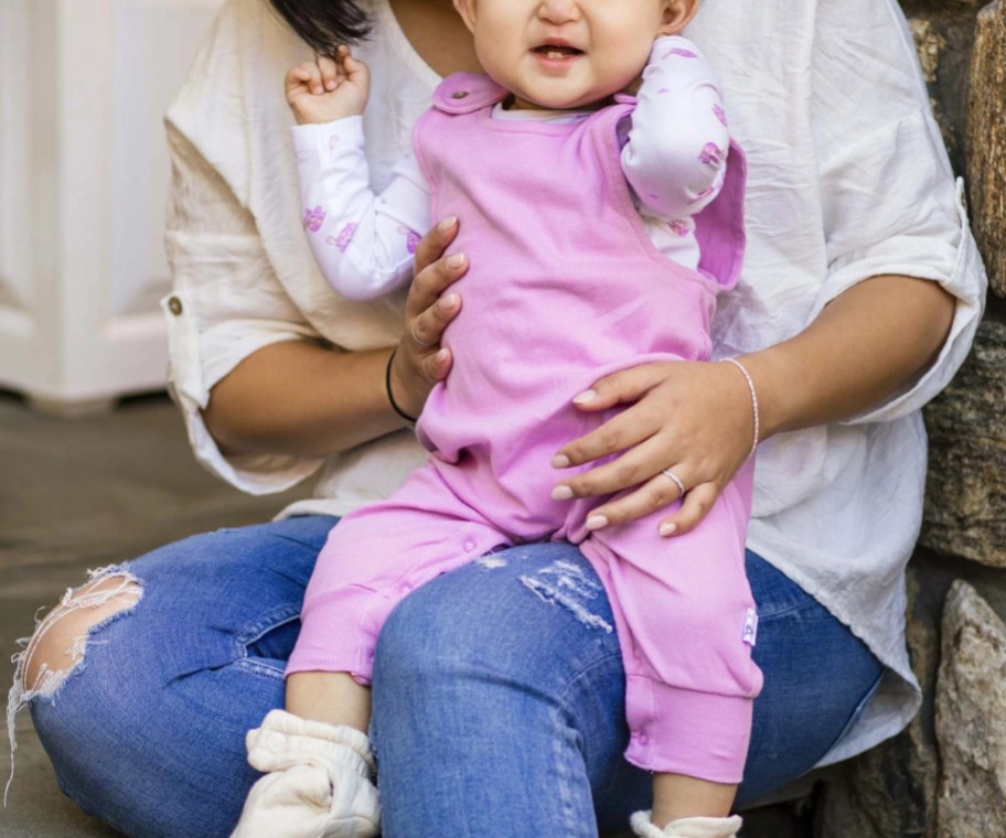 baby in pink jumpsuit