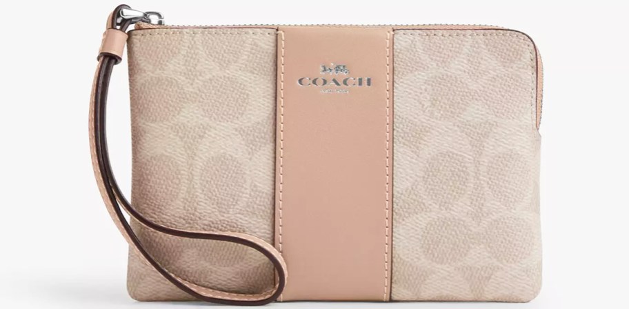 coach wristlet with taupe stripe in center