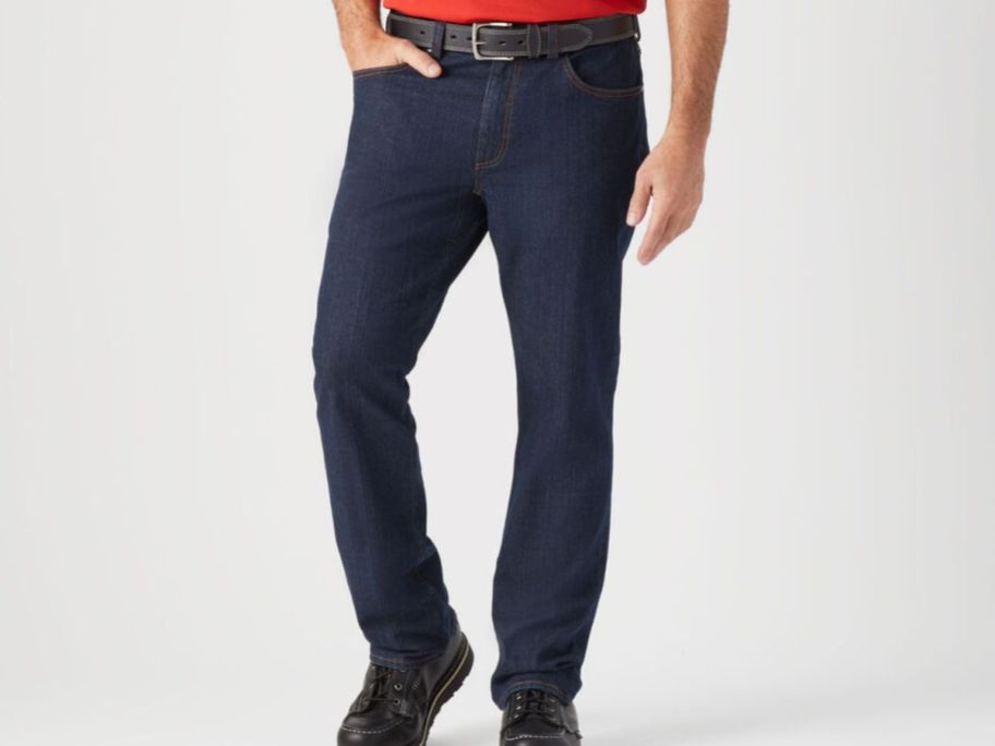 A man wearing dark jeans