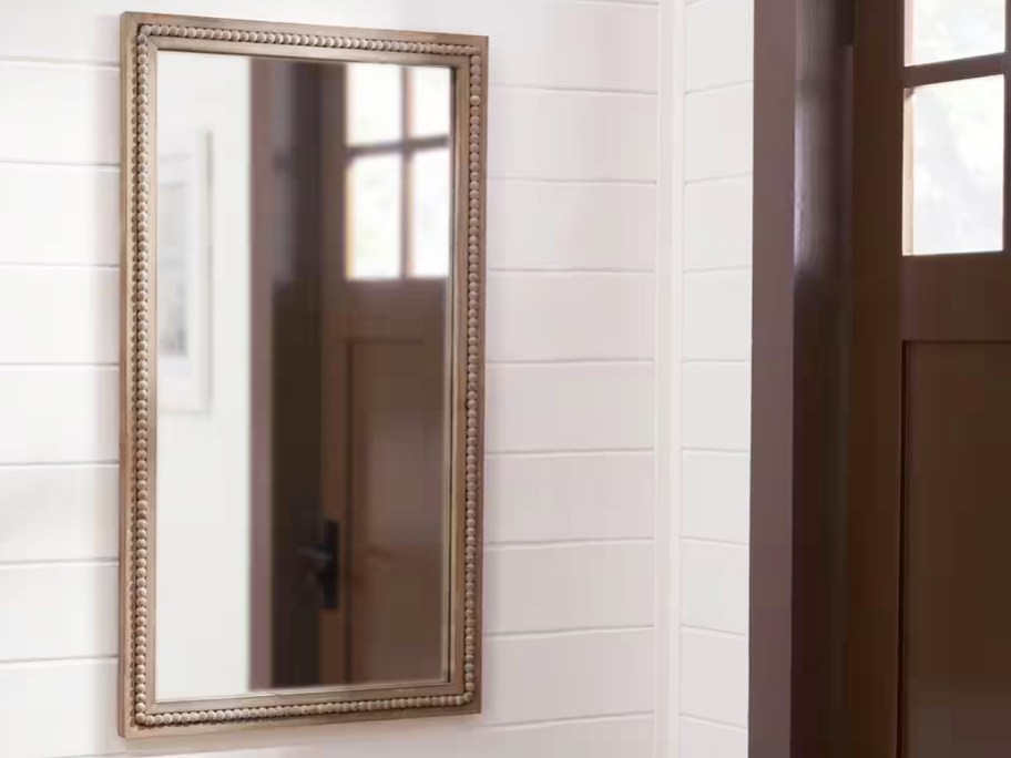 rectangle mirror on wall in entryway