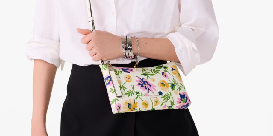 woman carrying floral crossbody bag