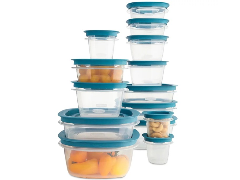 a stack clear food containers with teal green lids, some have food in them, others don't