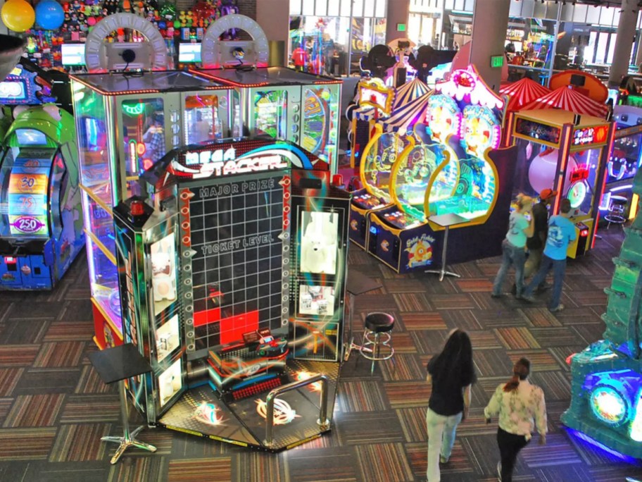 people walking through arcade 