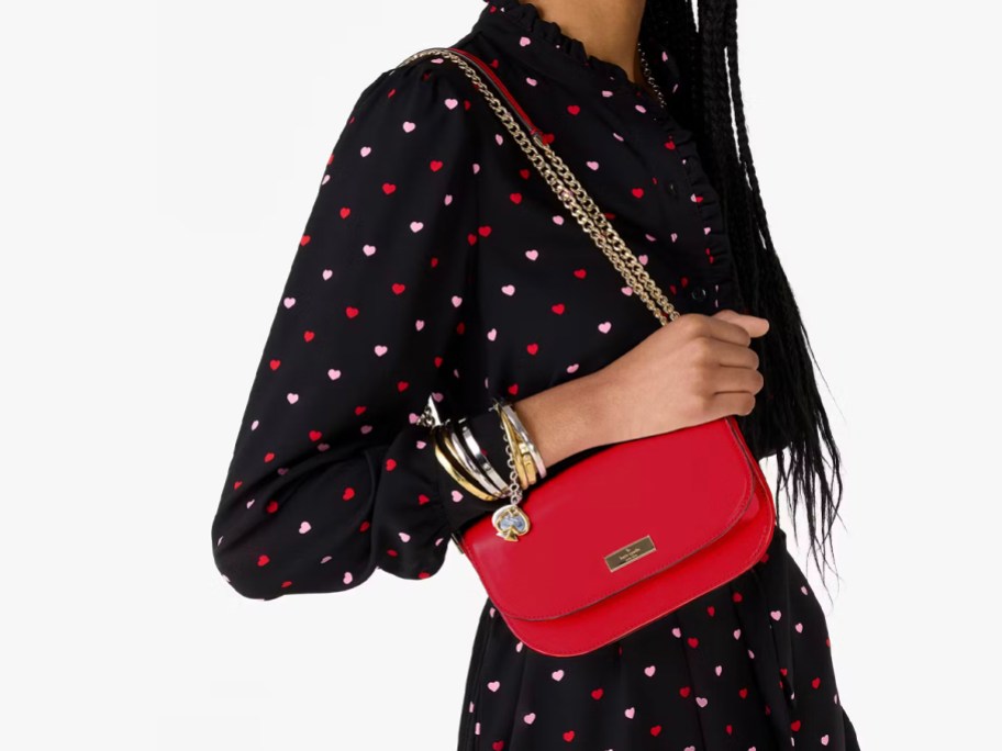 woman wearing red chain crossbody