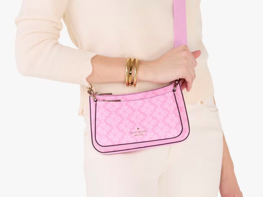 woman wearing pink crossbody kate spade flower bag